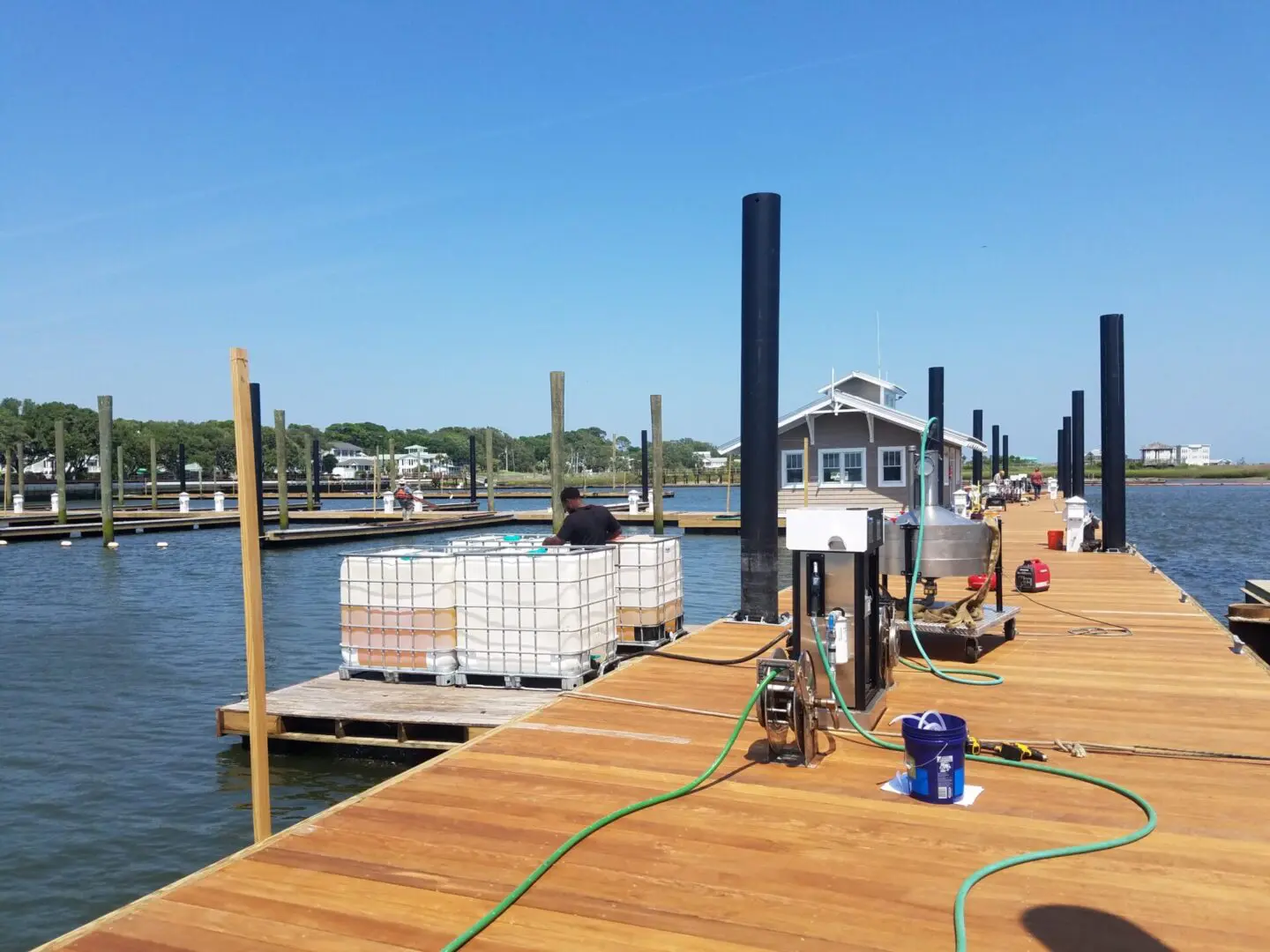 A dock with several boats docked in it.