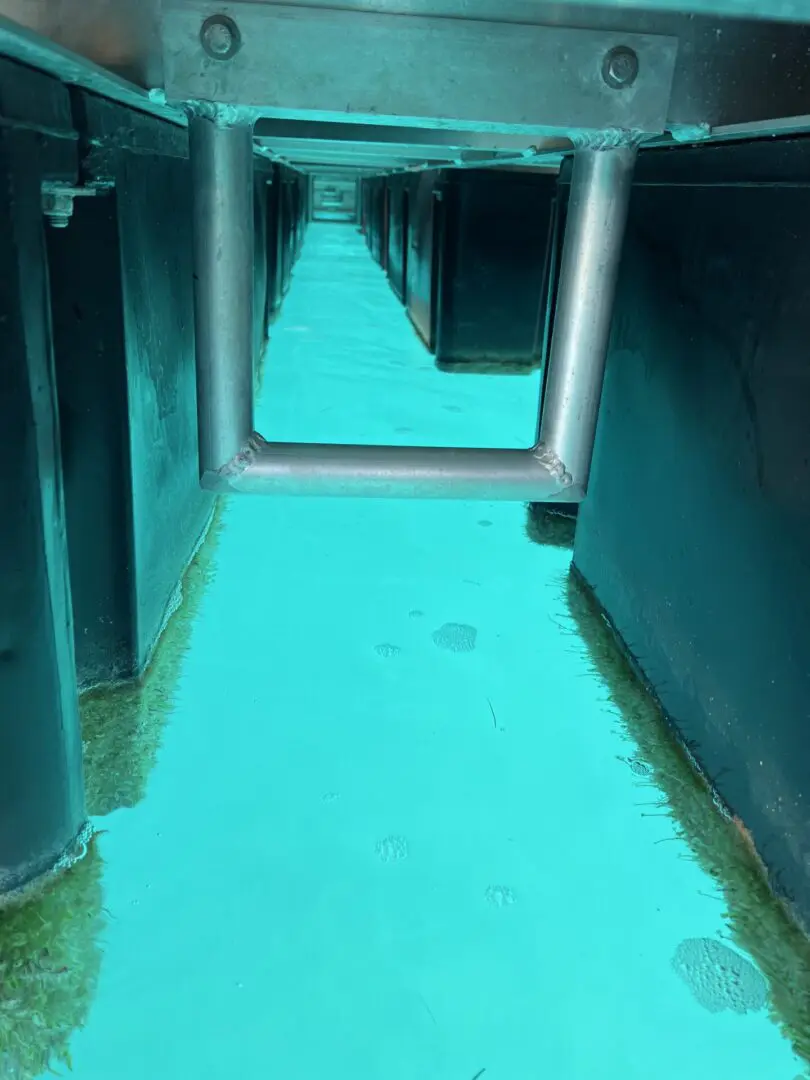 A hallway with blue paint on the ground.