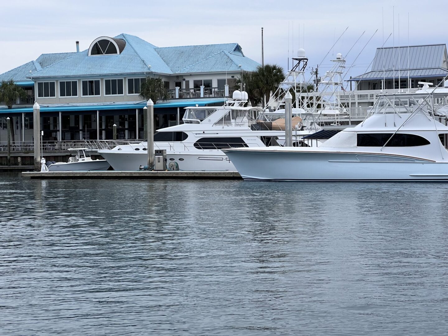 A marina with boats parked in the water.